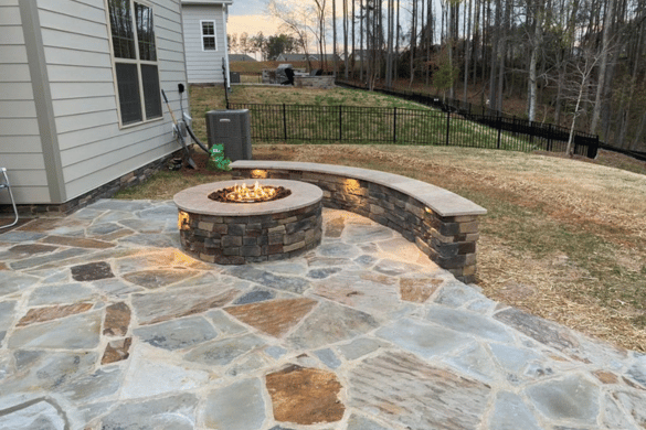 Custom fire pit and patio installation by professional Hardscaping Contractor Indian Land, SC, featuring natural flagstone patio
