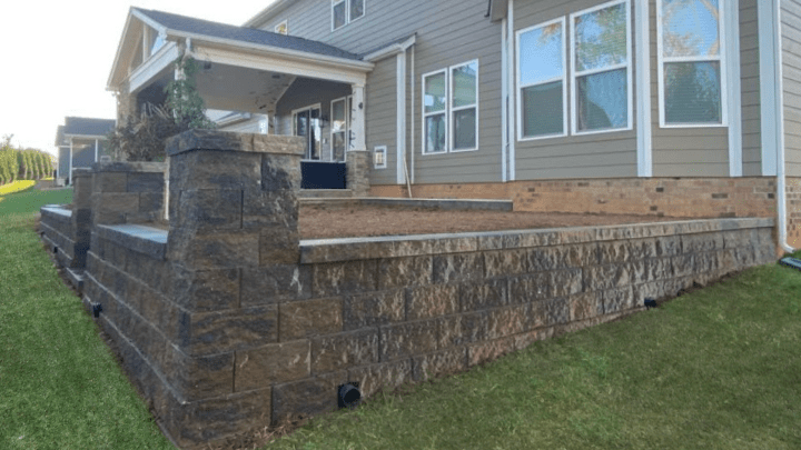 Hardscaping Contractor in Charlotte-Retaining Wall Installation Custom stone retaining wall built by expert Hardscaping Contractor in Charlotte