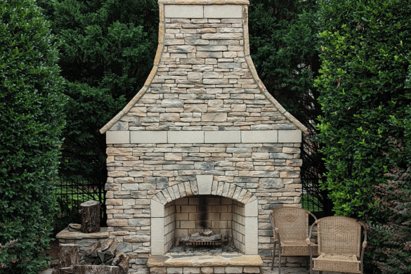 Custom outdoor stone fireplace built by experienced Hardscaping contractor Belmont, NC