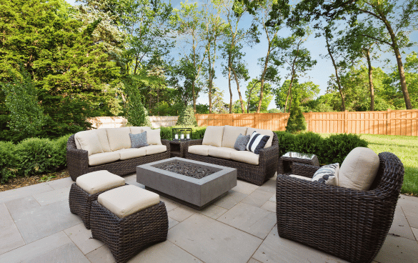 Hardscaping contractor Fort Mill, SC Modern concrete patio installation by professional Hardscaping contractor Fort Mill, SC, featuring large format concrete pavers with contemporary fire table and luxury outdoor furniture for upscale backyard entertaining space